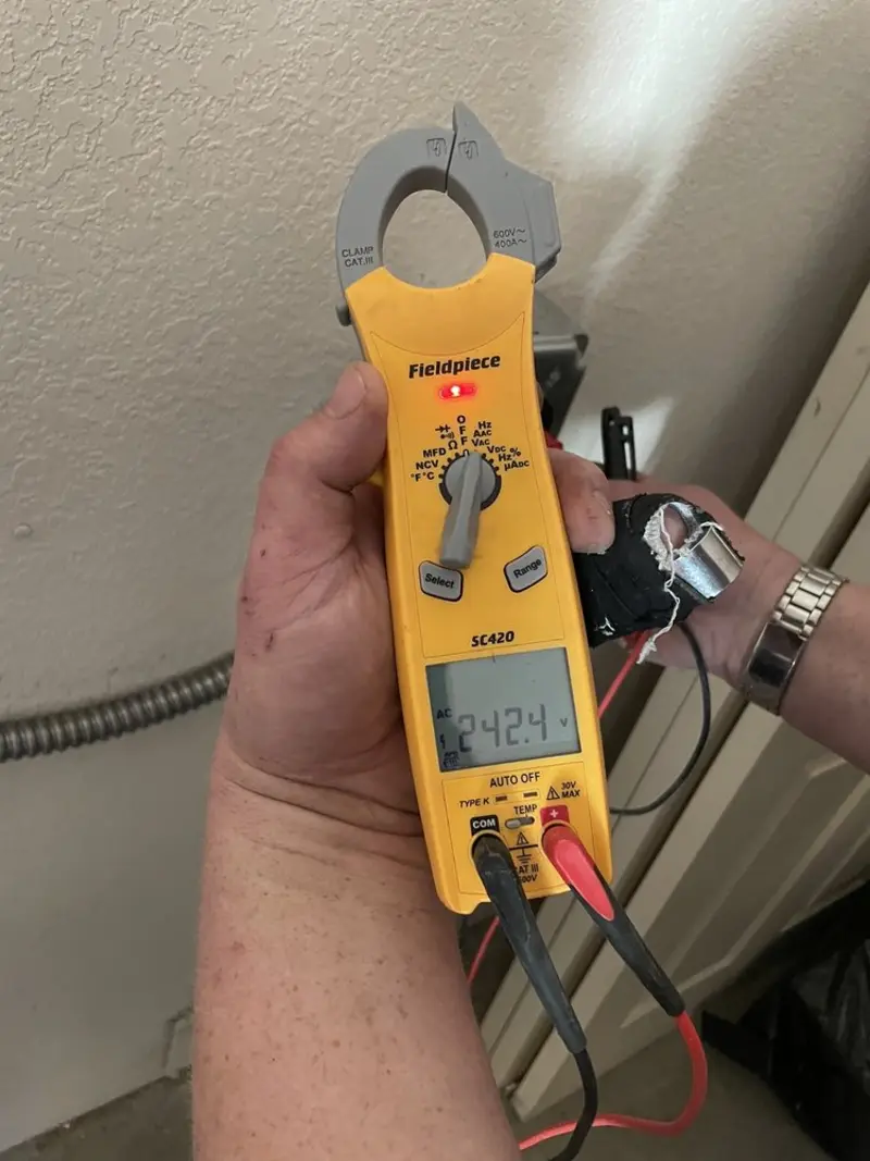 Voltage testing with clamp meter during Aluminum Wiring Replacement in Westway